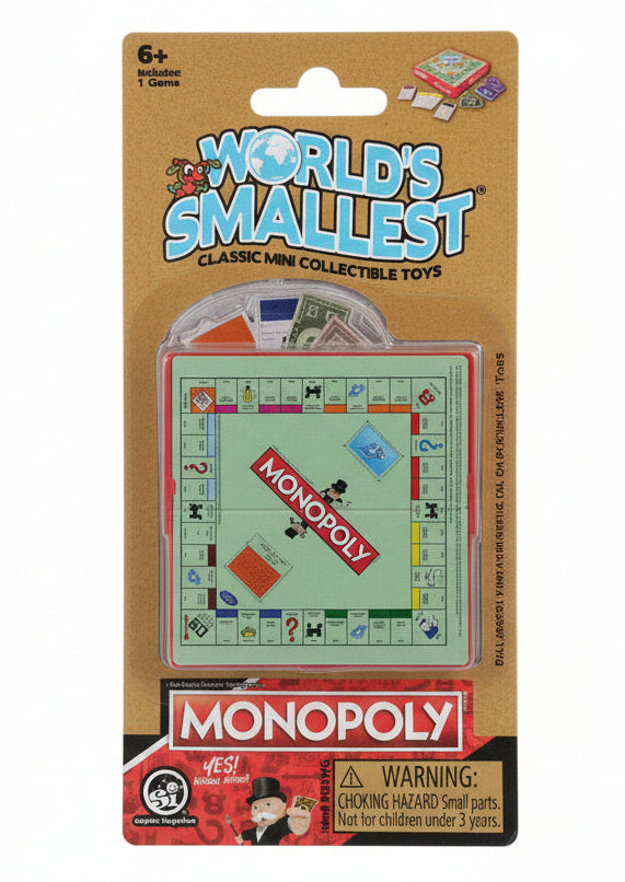World's Smallest Classic Mini Collectible Toys Monopoly board game in its original blister card packaging, featuring the green game board and red play money inside a clear plastic bubble on a brown cardboard backing.