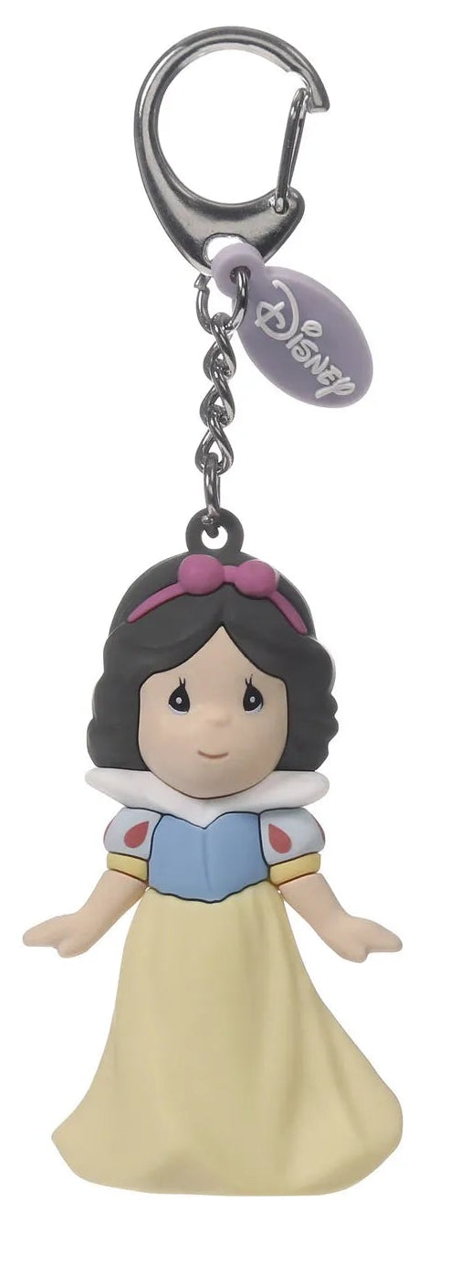 A Macanoco & Co. Disney Snow White keychain charm featuring a 3D-style figure of Snow White in her blue and yellow dress, attached to a silver lobster clasp and a Disney tag, shown on a white background.