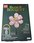 A Block Tech Block Bouquet Peony building block set box, containing 79 pieces. The packaging is dark green with a large pink peony flower illustration in the center, and features a warning label and age rating of 6+ on a beige carpet background.