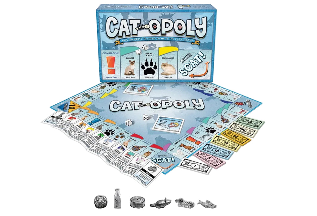 Cat Opoly board game set displayed on a white background, showing the blue game box, the board, property cards, and several silver game pieces.