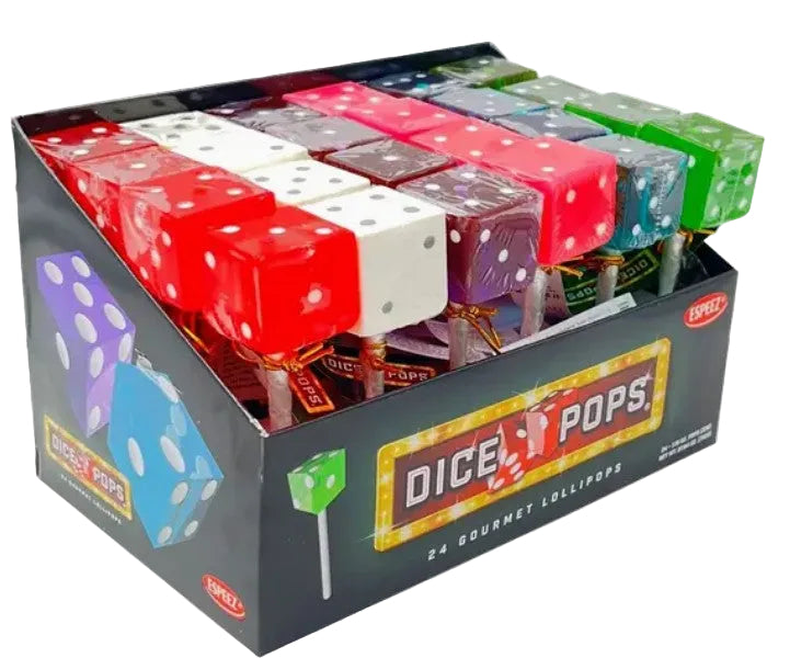 A display box of Expezi Dice Pops lollipops, showing multiple colorful translucent dice-shaped lollipops in red, white, purple, brown, blue, and green, packaged in a black cardboard box labeled 'DICE POPS'.
