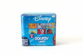 Disney Series 2 Squish 'ums! Surprise Low Foam Squishy Mums! blind box packaging, featuring colorful character graphics including Simba, Eeyore, Tinker Bell, Buzz Lightyear, Dalmatian, and Ariel on a blue background.