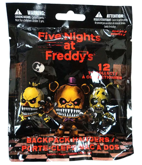A sealed black blind bag package for Five Nights at Freddy's Backpack Hangers, featuring character artwork of the animatronics and warning labels at the top.