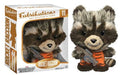 Fabrikations Rocket Raccoon soft sculpture by Enko, shown next to its original window box packaging. The plush toy is brown and gray with an orange striped shirt and holds a gray blaster.