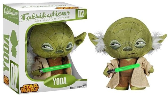 Yoda plush figure by Suko for Fabrikation, shown both inside its window box packaging and as an unpackaged figure holding a green lightsaber. The box features 'Fabrikation' and 'Star Wars' branding.