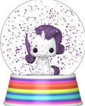A collectible snow globe featuring a small white cartoon unicorn with purple hair, surrounded by purple confetti inside a clear sphere, set on a rainbow-striped base.