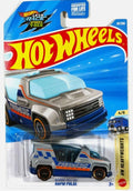 Hot Wheels Mattel Rocketz Attacks Truck 'Rapid Pulse' die-cast toy vehicle in its original blister card packaging, featuring a blue and gray ambulance truck with orange accents.
