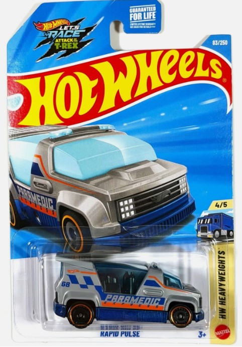 Hot Wheels Mattel Rocketz Attacks Truck 'Rapid Pulse' die-cast toy vehicle in its original blister card packaging, featuring a blue and gray ambulance truck with orange accents.