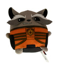 A Rocket Raccoon plush toy from Marvel's Guardians of the Galaxy, wearing an orange and black space suit, with a product tag attached on the right side.