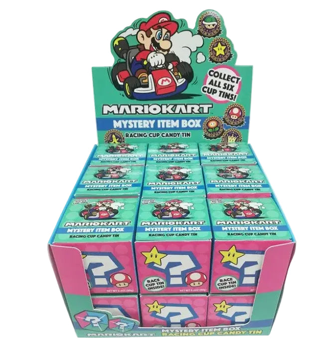 A Mario Kart Mystery Item Box retail display box filled with multiple individual blind box packs. The packaging features Mario Kart branding, character graphics, and colorful racing-themed designs in teal, pink, and blue.