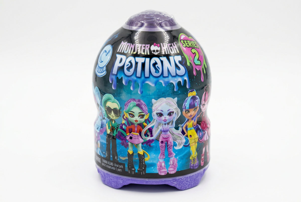 Monster High Potions blind bag toy container by Mattel, featuring colorful character illustrations and product details in French on a dark label, set on a gray textured surface.
