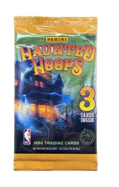 A sealed Panini Haunted Hoops NBA trading cards booster pack with a spooky haunted-house illustration and a large yellow '3 cards inside' graphic, shown on a plain light background.