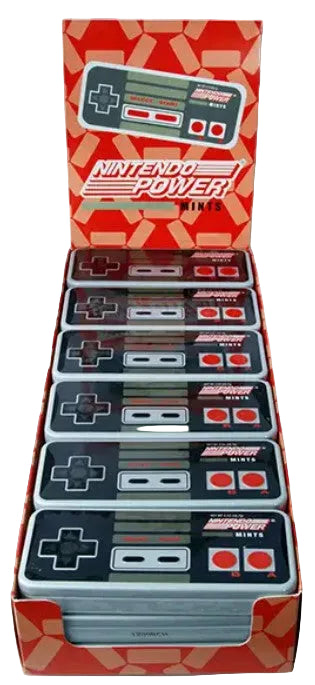 A retail display box filled with multiple vintage-style Nintendo Power Game Controllers, with the open back panel showing the Nintendo Power branding and a controller graphic.