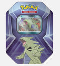 Pokémon Trading Card Game Tyranitar metal tin can, featuring a green Tyranitar card in the center and a large illustration of Tyranitar on the front, set against a light gray background.