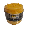 A yellow tub of Batman-themed body butter or soap with a black label featuring the Batman logo, set against a plain white background.